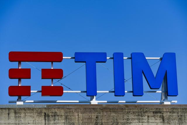 (FILES) The Telecom Italia (TIM) logo is pictured at the company's headquarters prior to the shareholders' meeting of Italian telecommunications company Telecom Italia (TIM) on March 29, 2019 in Rozzano, south of Milan. Italy's state-controlled postal service is launching a 10.8-billion euro takeover bid for telecom operator TIM, in which it already holds a majority stake, the companies said on March 23, 2026. (Photo by Miguel MEDINA / AFP)