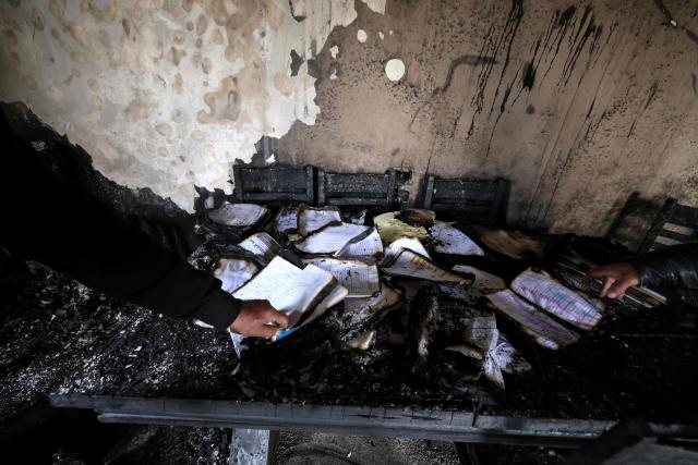 A Palestinian man inspects a burnt out home following a reported attack by Israeli settlers in the village of Deir al-Hatab, east of the city of Nablus, in the Israeli-occupied West Bank on March 23, 2026. Palestinian residents said on March 22, 2026, that Israeli settlers torched buildings and cars in attacks on several villages in the occupied West Bank, with Israel's army condemning "violence of any kind" after the fact.  Violence in the Palestinian West Bank, which Israel has occupied since 1967, has soared since the Hamas attack on Israel triggered the Gaza war in October 2023. (Photo by JAAFAR ASHTIYEH / AFP)