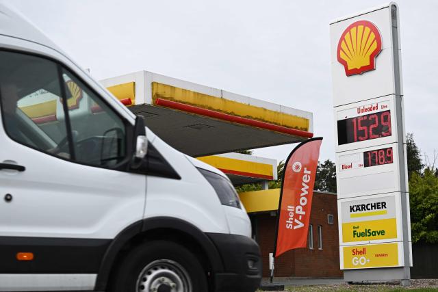 The price per litre of unleaded petrol and diesel fuels are pictured outside a Shell petrol station in Gayton, north west England on March 23, 2026. Oil prices on Monday jumped more than one percent with Brent above $113 and West Texas Intermediate topping $101. Stock markets tumbled as oil prices and the dollar jumped Monday after US President Donald Trump and Iranian leaders traded threats over the key Strait of Hormuz. (Photo by Paul ELLIS / AFP)
