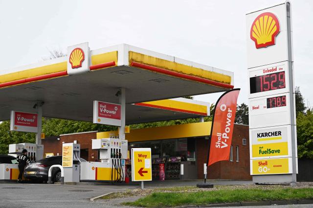 The price per litre of unleaded petrol and diesel fuels are pictured outside a Shell petrol station in Gayton, north west England on March 23, 2026. Oil prices on Monday jumped more than one percent with Brent above $113 and West Texas Intermediate topping $101. Stock markets tumbled as oil prices and the dollar jumped Monday after US President Donald Trump and Iranian leaders traded threats over the key Strait of Hormuz. (Photo by Paul ELLIS / AFP)