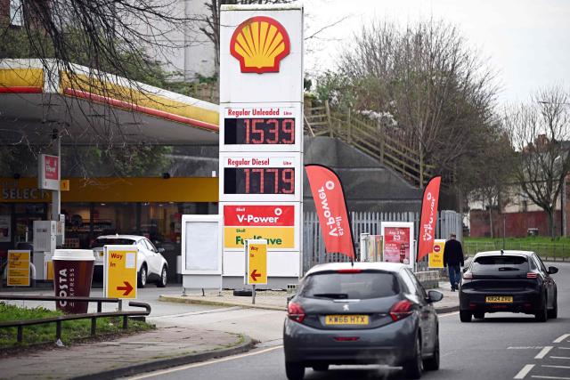 The price per litre of unleaded petrol and diesel fuels are pictured outside a Shell petrol station in Birkenhead, north west England on March 23, 2026. Oil prices on MOnday jumped more than one percent with Brent above $113 and West Texas Intermediate topping $101. Stock markets tumbled as oil prices and the dollar jumped Monday after US President Donald Trump and Iranian leaders traded threats over the key Strait of Hormuz. (Photo by Paul ELLIS / AFP)