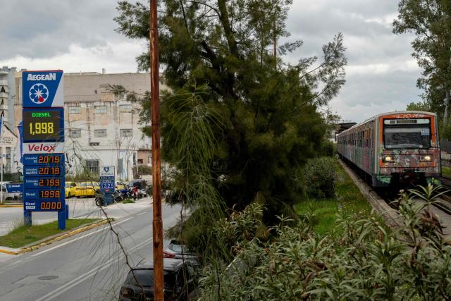 A price board is pictured at a gas station in Athens on March 23, 2026. Oil prices tumbled on March 23, 2026  after US President Donald Trump said the US was postponing strikes on Iranian power plants and energy infrastructure after "very good" talks with Iran. (Photo by Aggelos NAKKAS / AFP)