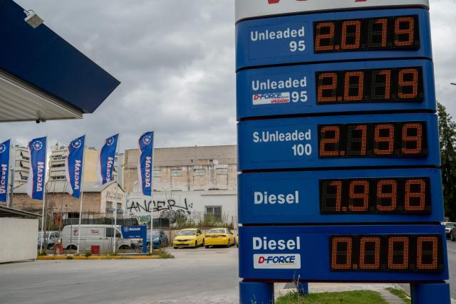 A price board is pictured at a gas station in Athens on March 23, 2026. Oil prices tumbled on March 23, 2026  after US President Donald Trump said the US was postponing strikes on Iranian power plants and energy infrastructure after "very good" talks with Iran. (Photo by Aggelos NAKKAS / AFP)