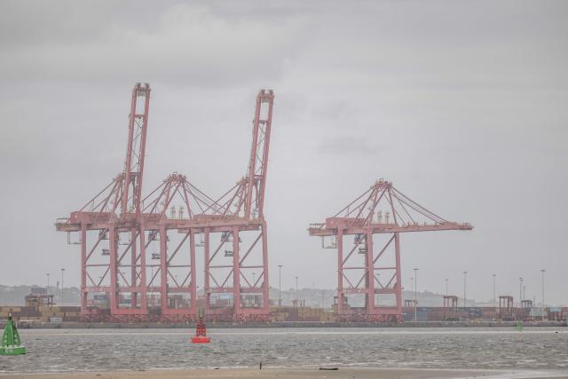 A general view of a cranes and containers at the Durban Harbour in Durban on March 23, 2026. (Photo by RAJESH JANTILAL / AFP)
