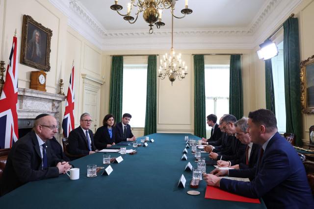Britain's Prime Minister Keir Starmer (2L) holds a meeting with representatives of the Jewish community inside 10 Downing Street in London on March 23, 2026, following an antisemitic arson attack in the Golders Green neighbourhood of north London overnight where volunteer ambulances run by a Jewish organisation were set on fire. Britain's Prime Minister Keir Starmer on March 23 condemned "a deeply shocking antisemitic arson attack" on volunteer ambulances run by a Jewish organisation in London. (Photo by Toby Melville / POOL / AFP)