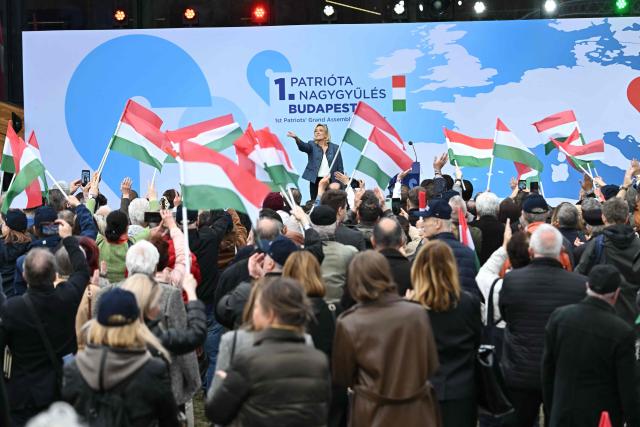Former leader of the French far-right National Rally (Rassemblement National, RN) party Marine Le Pen acknowledges the audience during the first Patriotic Rally at the Millenaris Cultural Center in Budapest, Hungary, March 23, 2026, a key campaign event for the upcoming April elections. In the April 12, 2026 vote, Hungarian Prime Minister Viktor Orban is facing his toughest challenge since he returned to power in 2010, according to opinion polls, against a backdrop of a stagnating economy and growing discontent with public services, among other issues. (Photo by Attila KISBENEDEK / AFP)