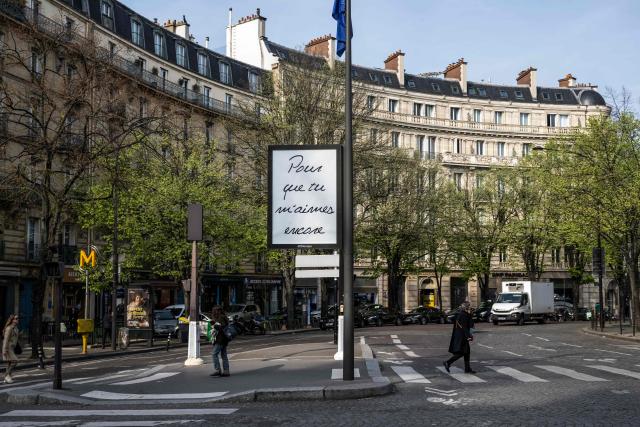 This photograph shows a billboard displaying the title of Canadian singer Celine Dion song "Pour que tu m'aimes encore" in central Paris on March 23, 2026. "Pour que tu m'aimes encore" or "My Heart Will Go On" can be read on mysterious posters in Paris, also featuring other iconic titles by Celine Dion and suggesting the big return of the Quebec diva for a series of concerts. (Photo by Blanca CRUZ / AFP)