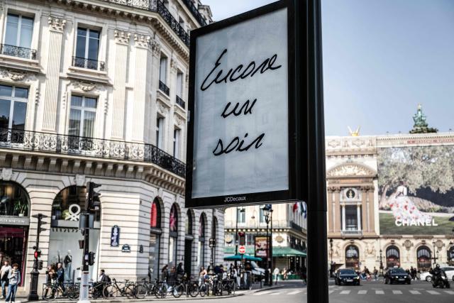 This photograph shows a billboard displaying the title of Canadian singer Celine Dion song "Encore un soir" in central Paris on March 23, 2026. "Pour que tu m'aimes encore" or "My Heart Will Go On" can be read on mysterious posters in Paris, also featuring other iconic titles by Celine Dion and suggesting the big return of the Quebec diva for a series of concerts. (Photo by Blanca CRUZ / AFP)