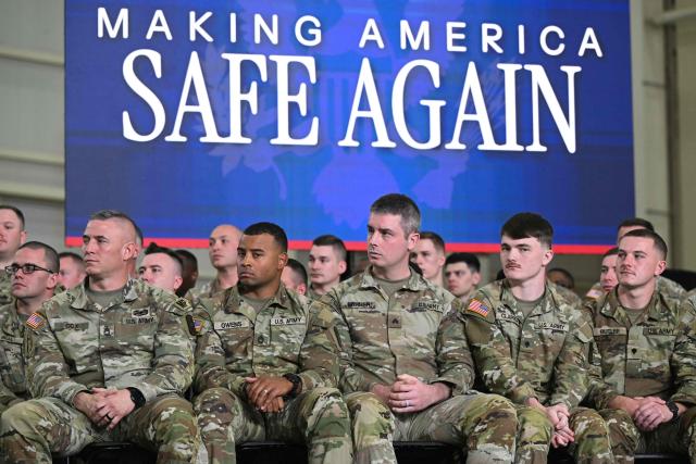 Members of the US military listen as President Donald Trump speaks during the Memphis Safe Task Force roundtable in Memphis, Tennessee on March 23, 2026. (Photo by SAUL LOEB / AFP)