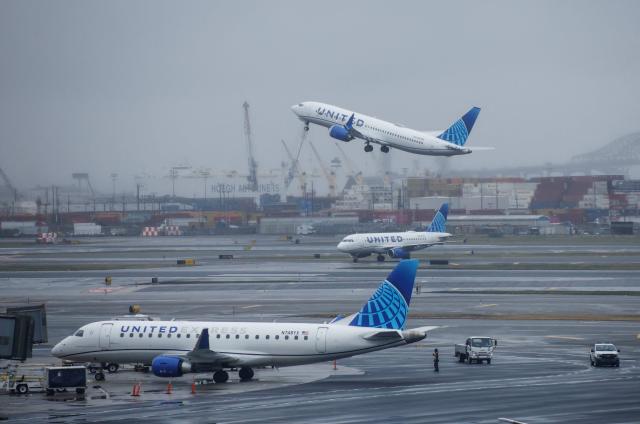 A United Airlines passenger plane takes off at Newark International Airport in Newark, New Jersey, on March 23, 2026. Immigration agents will be deployed in US airports beginning Monday, aiming to alleviate soaring congestion at security screenings amid a weeks-long budget standoff over President Donald Trump's mass deportation drive, officials said. (Photo by kena betancur / AFP)