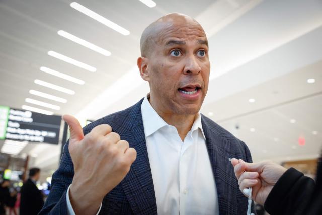 US Senator Cory Booker, Democrat from New Jersey, speaks to the press at Newark International Airport in Newark, New Jersey, on March 23, 2026. Immigration agents will be deployed in US airports beginning Monday, aiming to alleviate soaring congestion at security screenings amid a weeks-long budget standoff over President Donald Trump's mass deportation drive, officials said. (Photo by kena betancur / AFP)