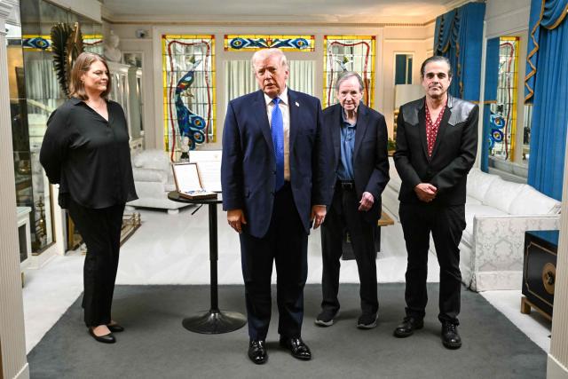 US President Donald Trump speaks to reporters as he visits Graceland, the estate of Elvis Presley, in Memphis, Tennessee on March 23, 2026. (Photo by SAUL LOEB / AFP)