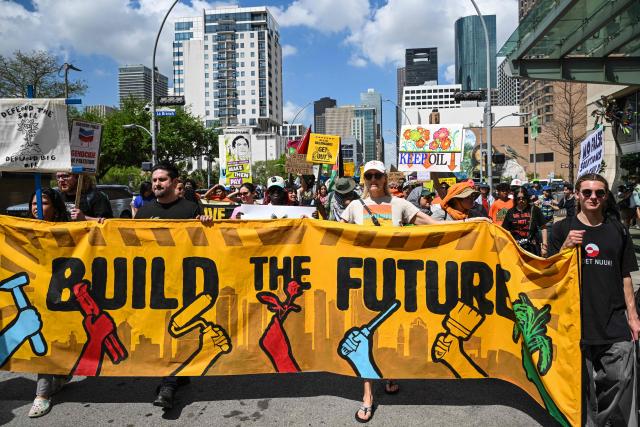 Demonstrators march to protest against the 2026 CERAWeek by S&P Global energy conference in Houston, Texas on March 23, 2026.  (Photo by RONALDO SCHEMIDT / AFP)
