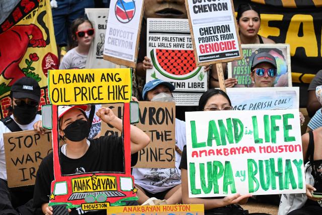 Demonstrators march to protest against the 2026 CERAWeek by S&P Global energy conference in Houston, Texas on March 23, 2026.  (Photo by RONALDO SCHEMIDT / AFP)