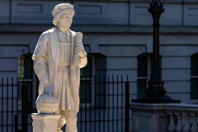 A statue of the explorer Christopher Columbus, placed by US President Donald Trump, stands near the White House at the Eisenhower Executive Office Building (EEOB) in Washington, DC, on March 23, 2026. In a Sunday press release, the Conference of Presidents of Major Italian American Organizations (COPOMIAO) said the statue, a replica of one that originally stood in Baltimore, “now stands on the White House grounds in celebration of Italian American history and culture.” (Photo by Jim WATSON / AFP)