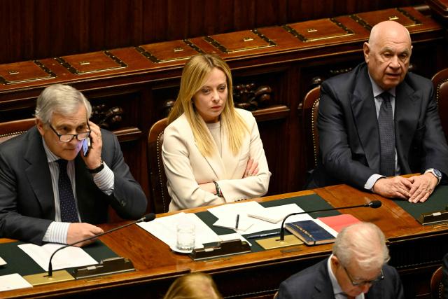 (FILES) Italy's Deputy Prime Minister and Foreign Minister, Antonio Tajani (L), Italy's Prime Minister, Giorgia Meloni and Italy's Justice Minister Carlo Nordio attend a session at the Italian Parliament for communications ahead of the European Council meeting, and on developments in the Middle East crisis, on March 11, 2026. Italian Prime Minister Giorgia Meloni on March 23, 2026 conceded defeat in a referendum on her justice reforms, while confirming she would not hand in her resignation. With almost all ballots counted from the Sunday-Monday vote, the "No" camp was at almost 54 percent, compared to just over 46 percent for "Yes", according to official figures. (Photo by Andreas SOLARO / AFP)