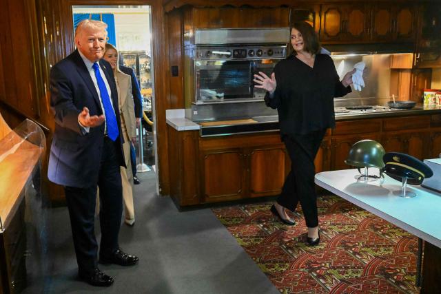 US President Donald Trump tours the kitchen of Graceland, the estate of Elvis Presley, accompanied by Angie Marchese (R), vice president of Graceland's Archives and Exhibits, and US Attorney General Pam Bondi (C) in Memphis, Tennessee on March 23, 2026. (Photo by SAUL LOEB / AFP)