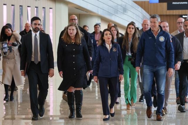 New York City Mayor Zohran Mamdani, New York Governor Kathy Hochul (2R), and US Secretary of Transportation Sean Duffy (R) arrive to speak to the press at LaGuardia Airport in New York, on March 23, 2026. Two pilots were killed and dozens of people injured after an Air Canada plane collided with a fire truck on a runway at New York's LaGuardia airport, US authorities said Monday. (Photo by TIMOTHY A. CLARY / AFP)