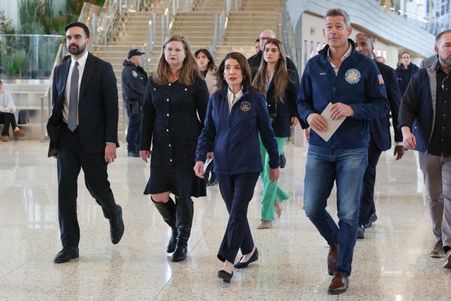 New York City Mayor Zohran Mamdani, New York Governor Kathy Hochul (2R), and US Secretary of Transportation Sean Duffy (R) arrive to speak to the press at LaGuardia Airport in New York, on March 23, 2026. Two pilots were killed and dozens of people injured after an Air Canada plane collided with a fire truck on a runway at New York's LaGuardia airport, US authorities said Monday. (Photo by TIMOTHY A.CLARY / AFP)