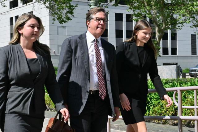 Plaintiffs' attorney Mark Lanier (C) arrives at Los Angeles Superior Court during the social media trial tasked to determine whether social media giants deliberately designed their platforms to be addictive to children, in Los Angeles, on March 23, 2026. The social media trial was tasked to determine whether social media giants deliberately designed their platforms to be addictive to children. (Photo by Frederic J. Brown / AFP)