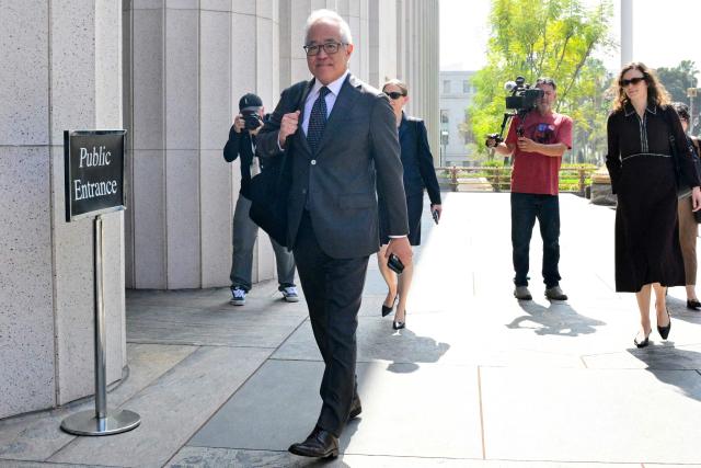 Attorney Luis Li, representing YouTube and Google arrives at Los Angeles Superior Court during the social media trial tasked to determine whether social media giants deliberately designed their platforms to be addictive to children, in Los Angeles, on March 23, 2026. The social media trial was tasked to determine whether social media giants deliberately designed their platforms to be addictive to children. (Photo by Frederic J. Brown / AFP)