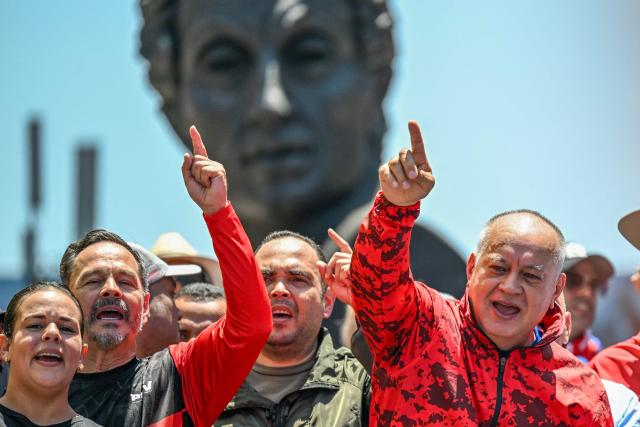 Venezuela's Minister of Interior, Justice and Peace Diosdado Cabello gestures during a march demanding the complete lifting of US sanctions in Caracas on March 23, 2026. (Photo by Juan BARRETO / AFP)