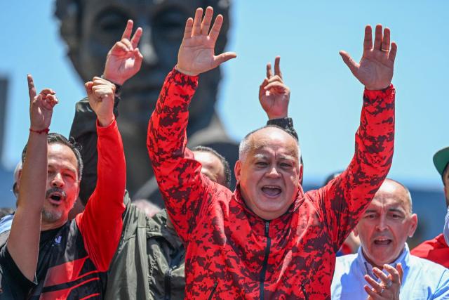 Venezuela's Minister of Interior, Justice and Peace Diosdado Cabello gestures during a march demanding the complete lifting of US sanctions in Caracas on March 23, 2026. (Photo by Juan BARRETO / AFP)