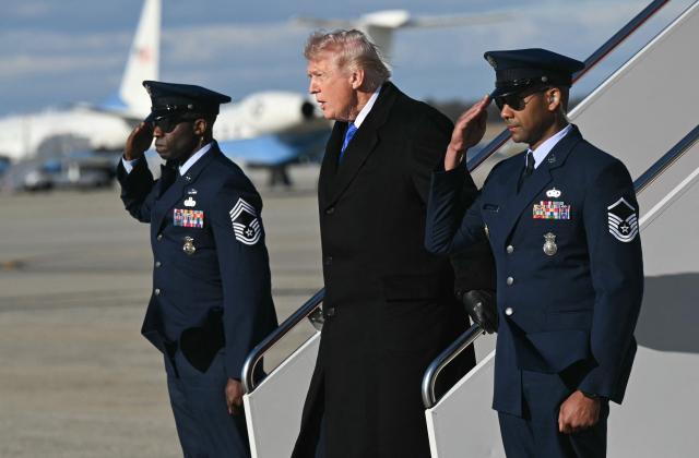 US President Donald Trump disembarks from Air Force One upon arrival at Joint Base Andrews in Maryland, March 23, 2026. Trump is returning to the White House after participating in the Memphis Safe Task Force Roundtable. (Photo by SAUL LOEB / AFP)