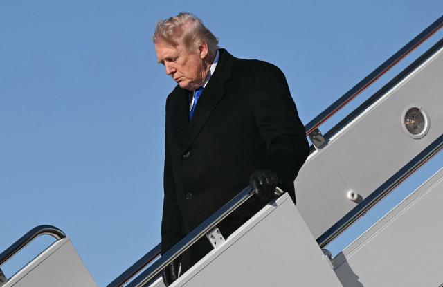 US President Donald Trump disembarks from Air Force One upon arrival at Joint Base Andrews in Maryland, March 23, 2026. Trump is returning to the White House after participating in the Memphis Safe Task Force Roundtable. (Photo by SAUL LOEB / AFP)