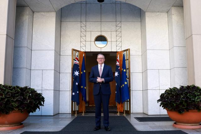 Australian Prime Minister Anthony Albanese waits to receive European Commission President Ursula von der Leyen for talks at Parliament House in Canberra on March 24, 2026. (Photo by DAVID GRAY / AFP)
