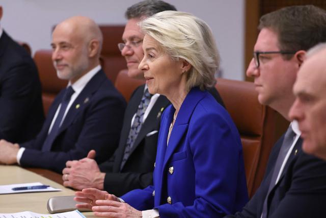 European Commission President Ursula von der Leyen (C) and EU Trade Commissioner Maros Sefcovic (2nd L) hold talks with Australian Prime Minister Anthony Albanese and his aides at Parliament House in Canberra on March 24, 2026. (Photo by David GRAY / AFP)