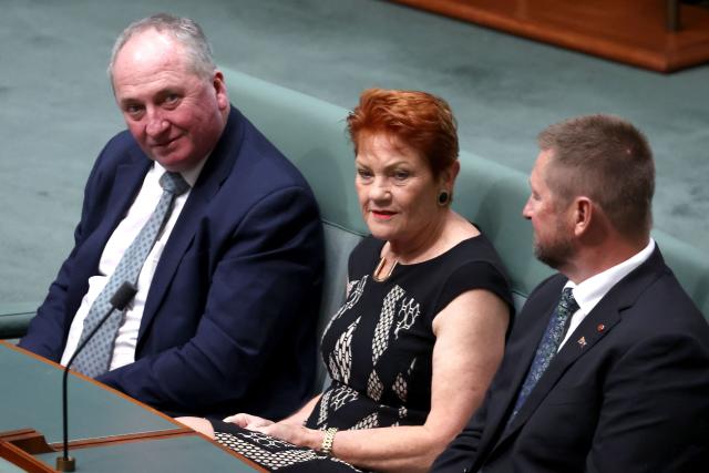 Australia’s One Nation Senator Pauline Hanson (C) and Member of the Parliament Barnaby Joyce (L) attend a joint sitting of the House of Representatives during an address by European Commission President Ursula von der Leyen in Canberra on March 24, 2026. (Photo by David GRAY / AFP)
