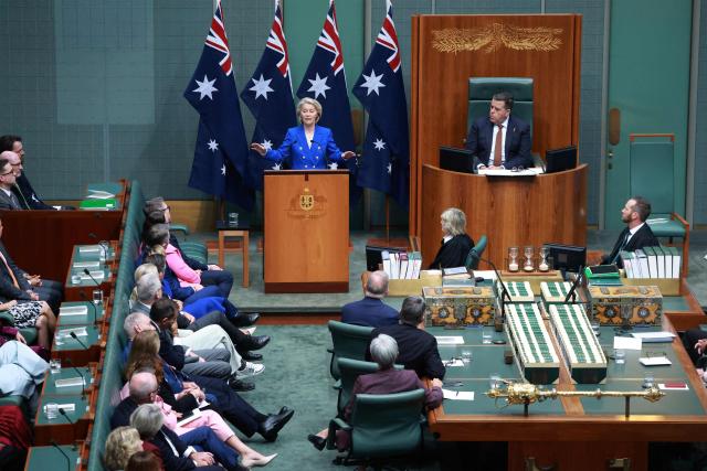 European Commission President Ursula von der Leyen addresses members and senators during a joint sitting of the House of Representatives at Parliament House in Canberra on March 24, 2026. (Photo by DAVID GRAY / AFP)