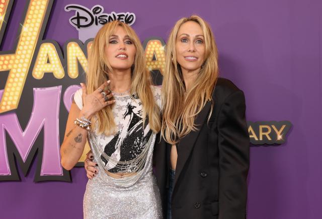 US singer-songwriter Miley Cyrus (L) and her mom producer Tish Cyrus attend the world premiere of Disney+'s "Hannah Montana 20th Anniversary Special" at El Capitan theater in Hollywood, California on March 23, 2026. (Photo by VALERIE MACON / AFP)