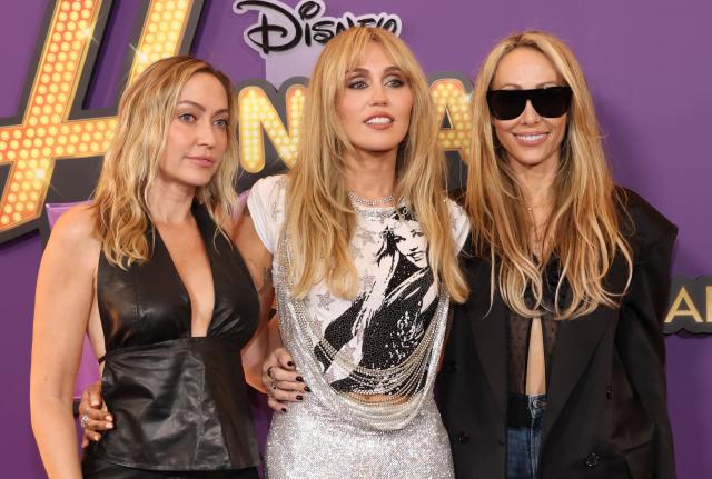 (L/R) US actress and DJ Brandi Cyrus, US singer-songwriter Miley Cyrus and US producer Tish Cyrus attend the world premiere of Disney+'s "Hannah Montana 20th Anniversary Special" at El Capitan theater in Hollywood, California on March 23, 2026. (Photo by VALERIE MACON / AFP)