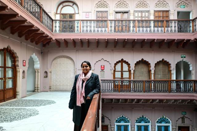 This photograph taken on February 2, 2026 shows Vidyun Goel, whose family owns the Dharampura Haveli, an 18th-century haveli-turned-heritage hotel in the old quarters of Delhi. Once the grand residences of Mughal-era nobility, the Indian capital's haveli homes now stand at fragile crossroads -- a handful lovingly restored but many more sliding quietly into ruin. (Photo by Manan VATSYAYANA / AFP)