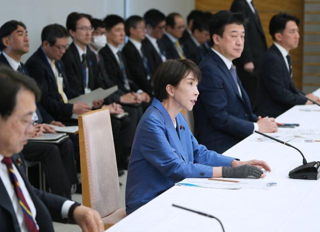Japan's Prime Minister Sanae Takaichi (C) speaks at a meeting of relevant ministers on the situation in the Middle East at the Prime Minister's Office in Tokyo on March 24, 2026. (Photo by JIJI PRESS / AFP) / Japan OUT
