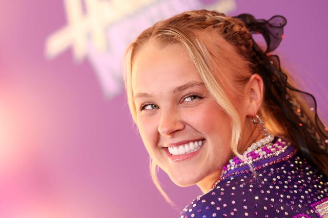 US singer JoJo Siwa attends the world premiere of Disney+'s "Hannah Montana 20th Anniversary Special" at El Capitan theater in Hollywood, California on March 23, 2026. (Photo by VALERIE MACON / AFP)