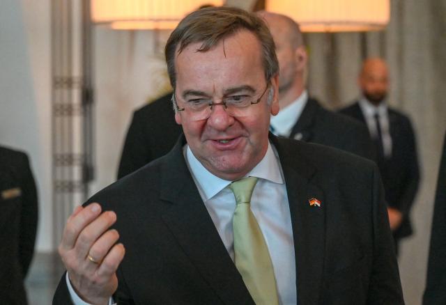 Germany's Defence Minister Boris Pistorius gestures during a presentation of the Federal Cross of Merit of Germany to Singapore's former Defence Minister Ng Eng Hen (not pictured) in Singapore on March 24, 2026. (Photo by Roslan RAHMAN / AFP)