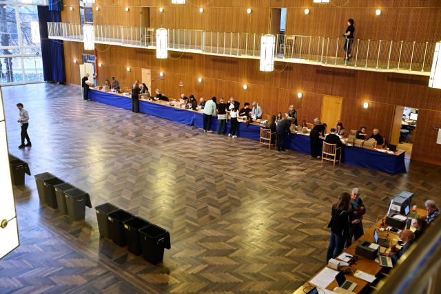 Citizens vote at a polling station during the parliamentary election at Aarhus City Hall in Aarhus on March 24, 2026. (Photo by Mikkel Berg Pedersen / Ritzau Scanpix / AFP) / Denmark OUT