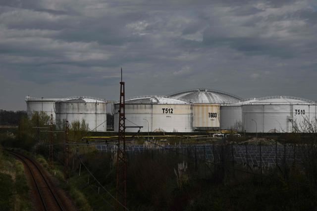 (FILES) Fuel storage tanks are pictured at the CCMP (Compagnie Commerciale de Manutention Petroliere) petroleum depot in Pauillac, north of Bordeaux, south-western France, on March 10, 2026. Brent crude oil jumped back above $100 a barrel on March 24, 2026, a day after plunging more than 10 percent in reaction to Donald Trump's decision to delay fresh strikes on Iran as he hailed "very good" talks with Tehran. (Photo by Philippe LOPEZ / AFP)