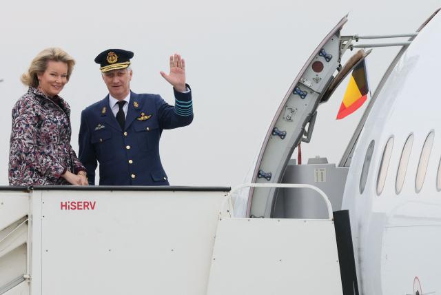Queen Mathilde of Belgium (L) and King Philippe of Belgium (R) are pictured upon their departure for their official state visit to Norway on March 24, 2026. (Photo by BENOIT DOPPAGNE / Belga / AFP) / Belgium OUT