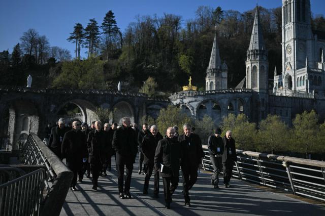 Bishops arrive to attend the plenary assembly of the bishops of France in Lourdes on March 24, 2026. (Photo by LIONEL BONAVENTURE / AFP)