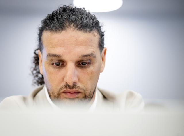 Dutch former coach on talent show "The Voice of Holland" Ali B. (C) attends a substantive hearing as part of his appeal trial at the Amsterdam Court of Appeal in Amsterdam on March 24, 2026. The 43-year-old rapper was sentenced to two years in prison for rape on July 12, 2024. (Photo by Sem van der Wal / ANP / AFP) / Netherlands OUT