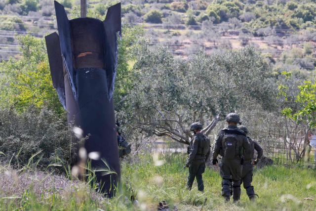 Israeli soldiers arrive to check an Iranian missile remnant that landed in the Israeli-occupied West Bank village of Hares on March 24, 2026. Since the United States and Israel unleashed strikes on Iran on February 28, war has spread across the Middle East, with casualties reported in countries across the region. (Photo by Jaafar ASHTIYEH / AFP) / 