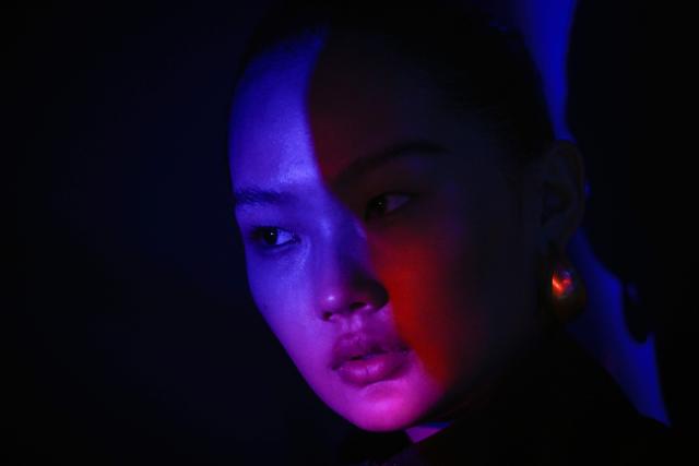 A model waits backstage before presenting a creation from the Yiyi collection by Song Shuang during the China Fashion week in Beijing on March 24, 2026. (Photo by WANG Zhao / AFP)