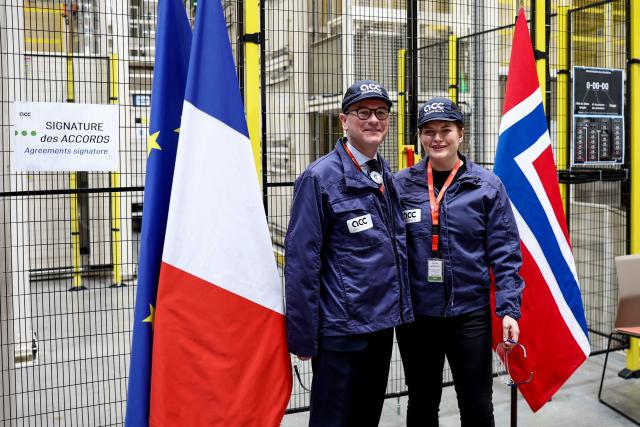 Norway's Industry minister Cecilie Myrseth (R) and France's junior Minister for Industry Sebastien Martin (L) pose during the signing ceremony of the updated Franco-Norwegian green industrial partnership and the memorandum of understanding on critical metals, as part of a visit at the European vehicle battery venture Automotive Cells (ACC) site in Billy-Berclau, northern France, on March 24, 2026. (Photo by Sameer AL-DOUMY / AFP)