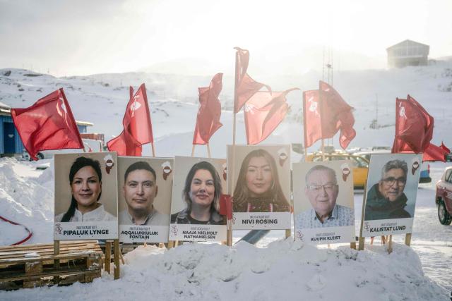 Placards bearing the portraits of candidates from Greenland's democratic socialist party Inuit Ataqatigiit are seen in Nuuk, Greenland, during general elections in Denmark, on March 24, 2026. Danes began voting on March 24, 2026 in general elections, with Prime Minister Mette Frederiksen seen as the favourite after standing up to US President Donald Trump over Greenland. The autonomous territory of Greenland is represented in the Dansih Parliament with two seats. (Photo by Oscar Scott Carl / Ritzau Scanpix / AFP) / Denmark OUT