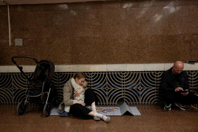People take shelter at a metro station during an air strike alarm in Kyiv on March 24, 2026, amid Russia’s ongoing invasion of Ukraine. (Photo by Tetiana DZHAFAROVA / AFP)