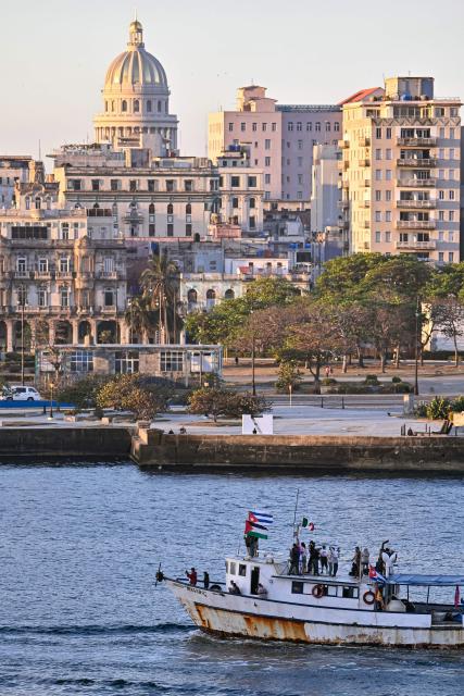 The vessel Maguro, arriving from Mexico with humanitarian aid as part of the Nuestra America convoy, docks at the port of Havana on March 24, 2026. (Photo by ADALBERTO ROQUE / AFP)